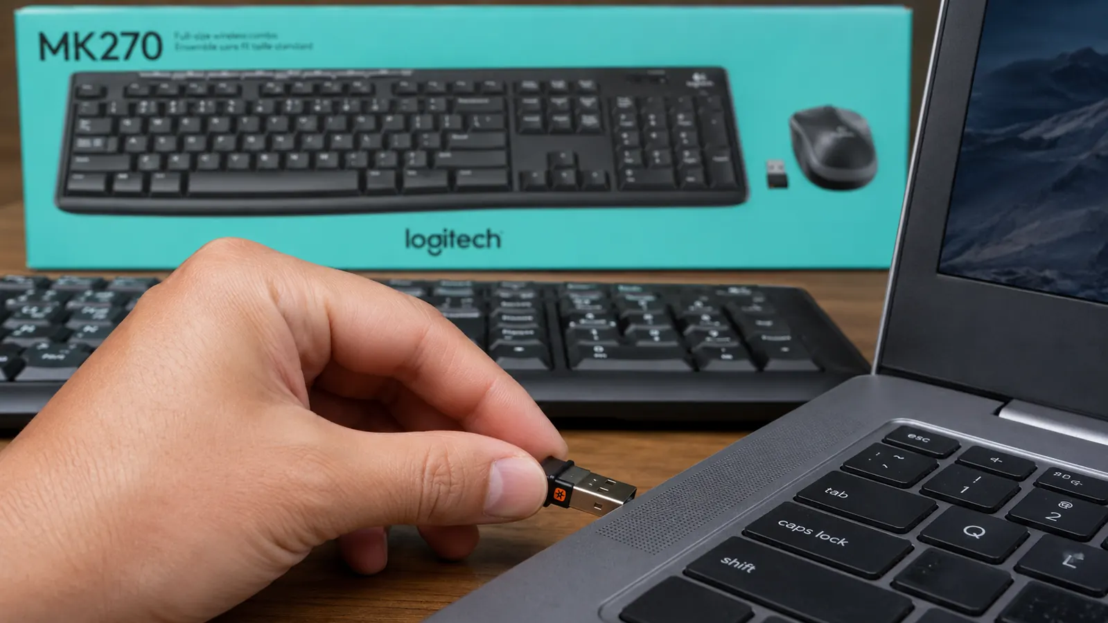 Logitech MK270 USB nano receiver being plugged into a laptop USB port, showing how compact the dongle is